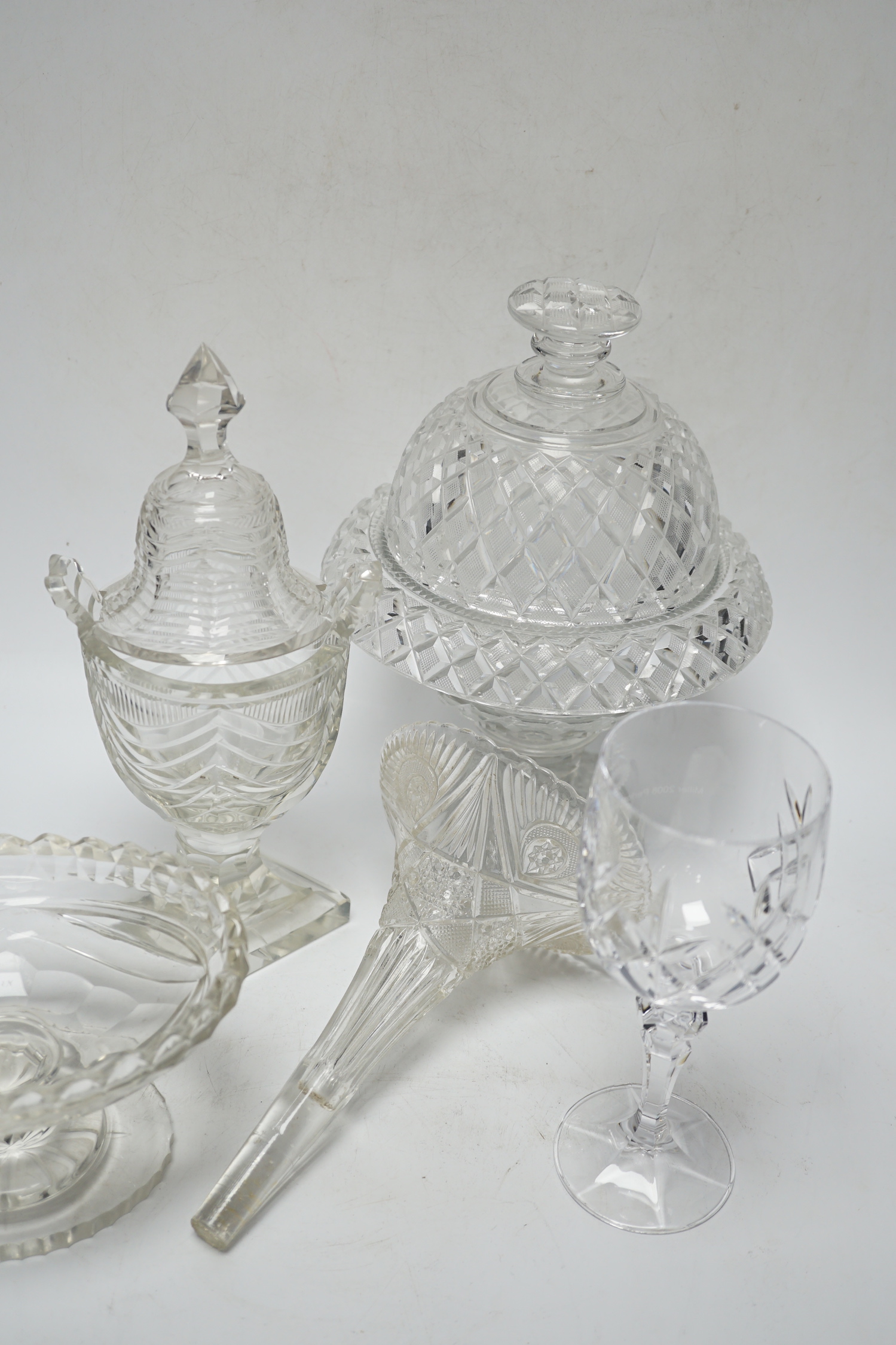 Ten cut glass items including; four pedestal bowls and covers, two oval, pedestal dishes, a two oval, pedestal dishes, a jug, a pair of glasses, etc., tallest, 26cm